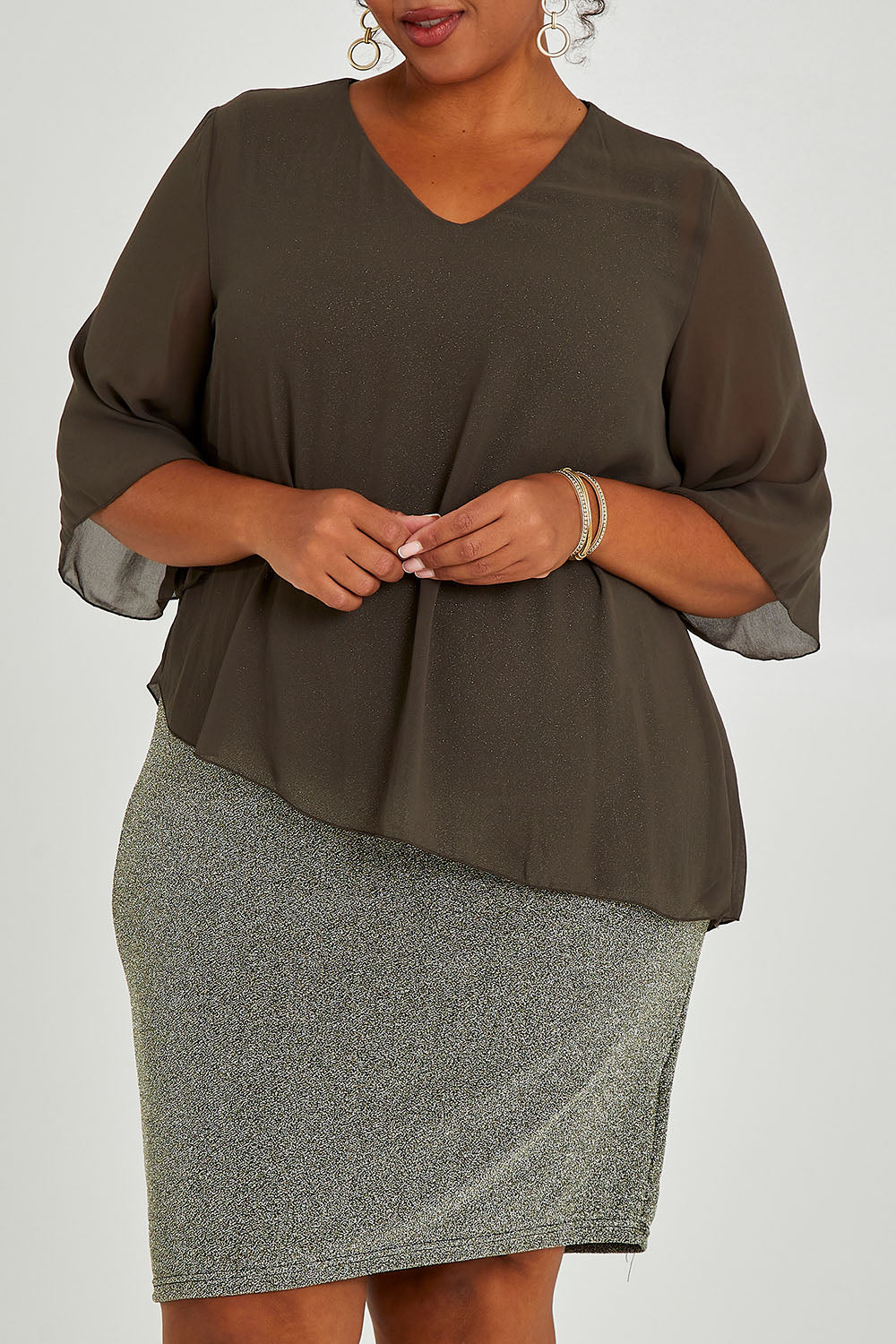 Model Alexis wearing size 16 of the Bridgette Dress in colour Khakisilv (Green), from the front, cropped image
