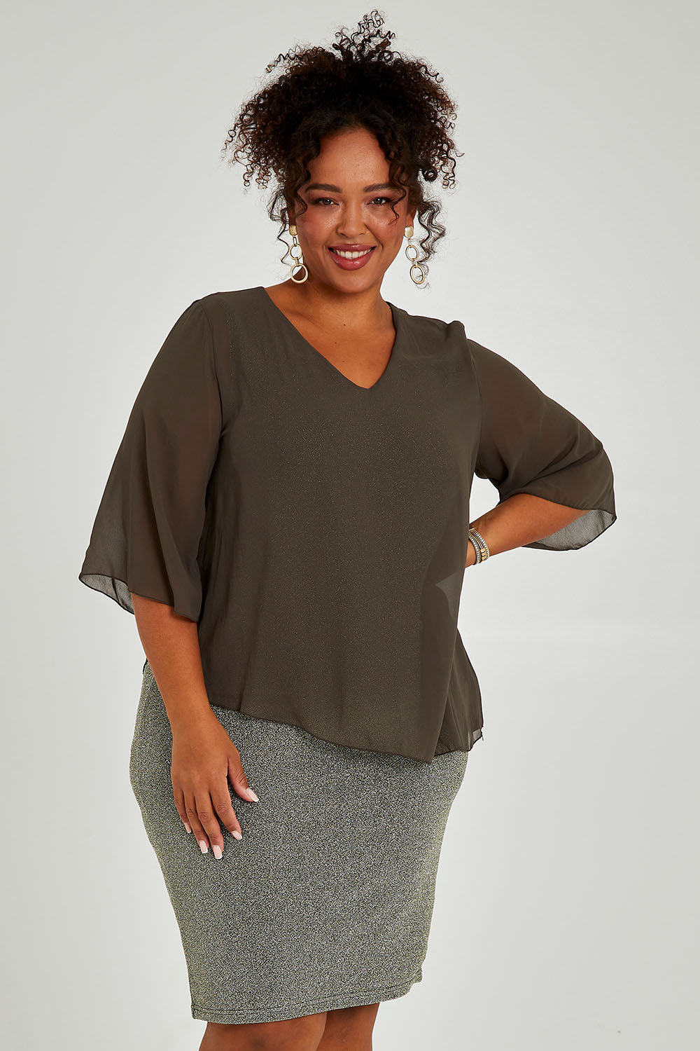 Model Alexis wearing size 16 of the Bridgette Dress in colour Khakisilv (Green), from the front, cropped image