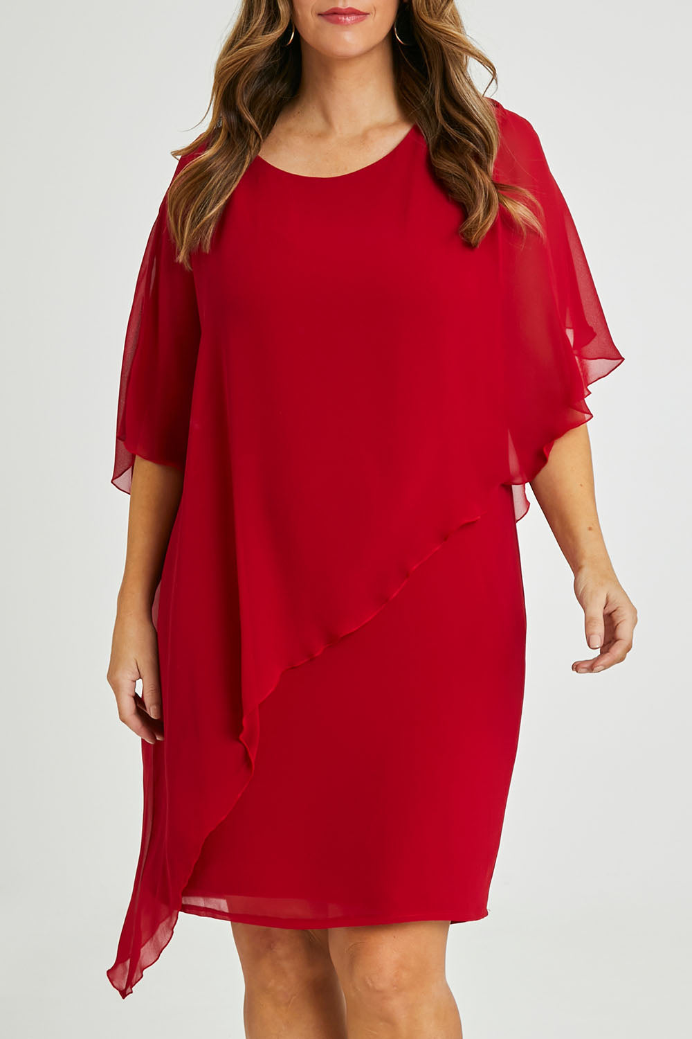Model Laura wearing size 14 of the Beatrice Dress in colour Red (Red), from the front, cropped image