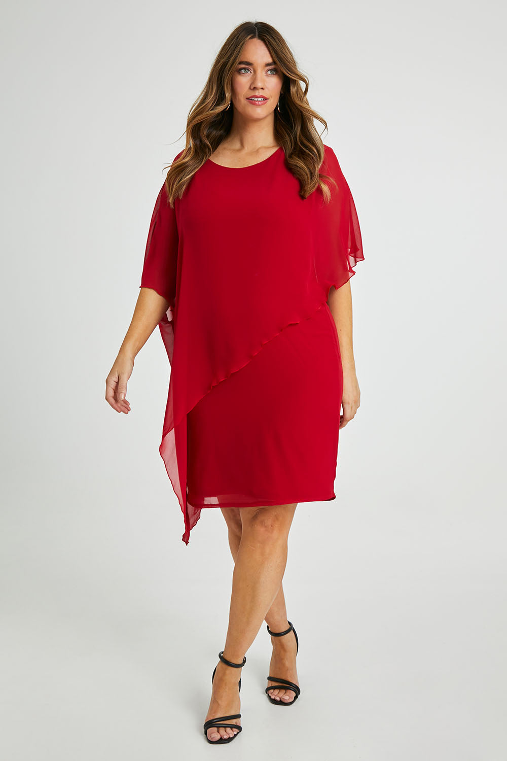 Model Laura wearing size 14 of the Beatrice Dress in colour Red (Red), from the front, showing the whole outfit