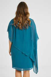 Model Laura wearing size 14 of the Beatrice Dress in colour Teal (Blue), from the back