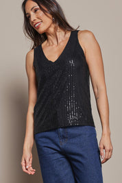 Model Amanda wearing size 10 of the Reece Top in colour Black (Black), from the front, cropped image