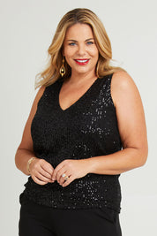 Model Fiona wearing size 16 of the Reece Top in colour Black (Black), from the front, cropped image