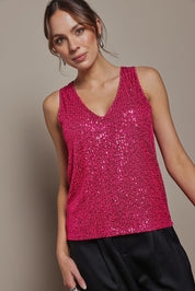 Model Madeline wearing size 10 of the Reece Top in colour Cerise (Metallics), from the front, cropped image
