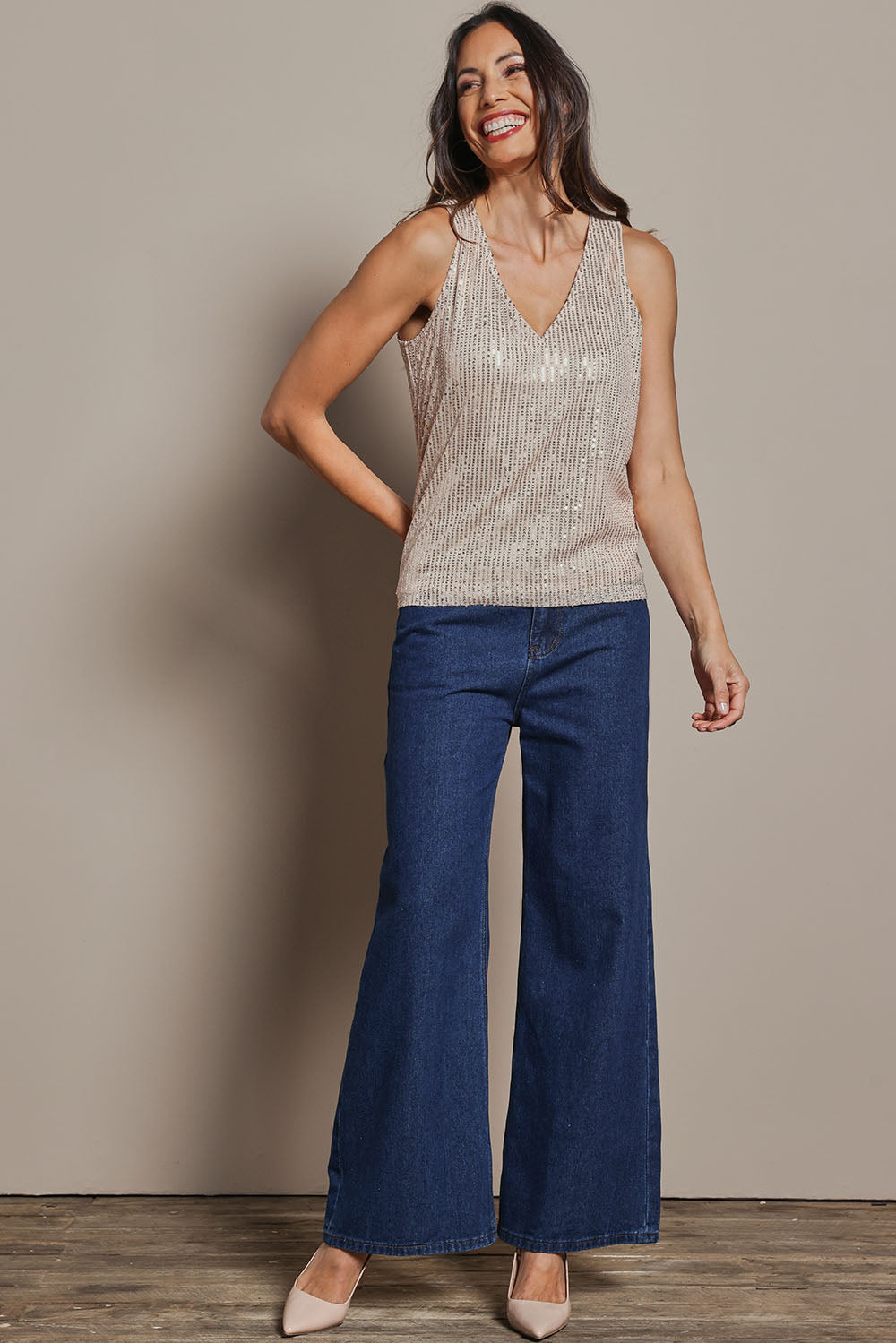 Model Amanda wearing size 10 of the Reece Top in colour Rosegold (Metallics), from the front, showing the whole outfit