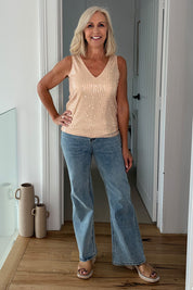 Model Sandy wearing size 10 of the Reece Top in colour Rosegold (Metallics), from the front, showing the whole outfit