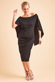 Model Grace wearing size 10 of the Cora Dress in colour Black (Black), from the front, showing the whole outfit