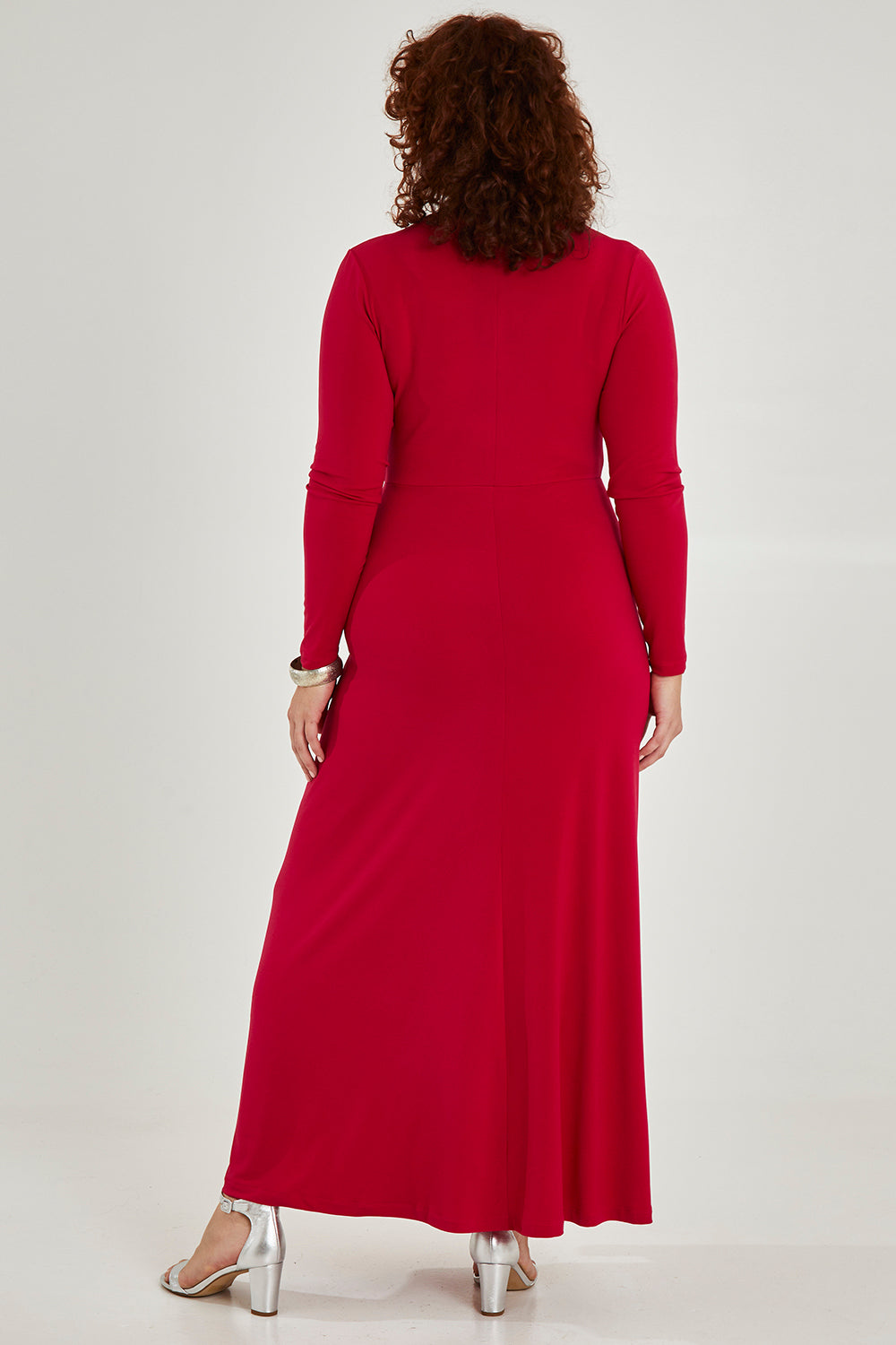 Model Maddy wearing size 16 of the Francesca Dress in colour Granita (Red), from the back