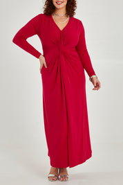 Model Maddy wearing size 16 of the Francesca Dress in colour Granita (Red), from the front, cropped image