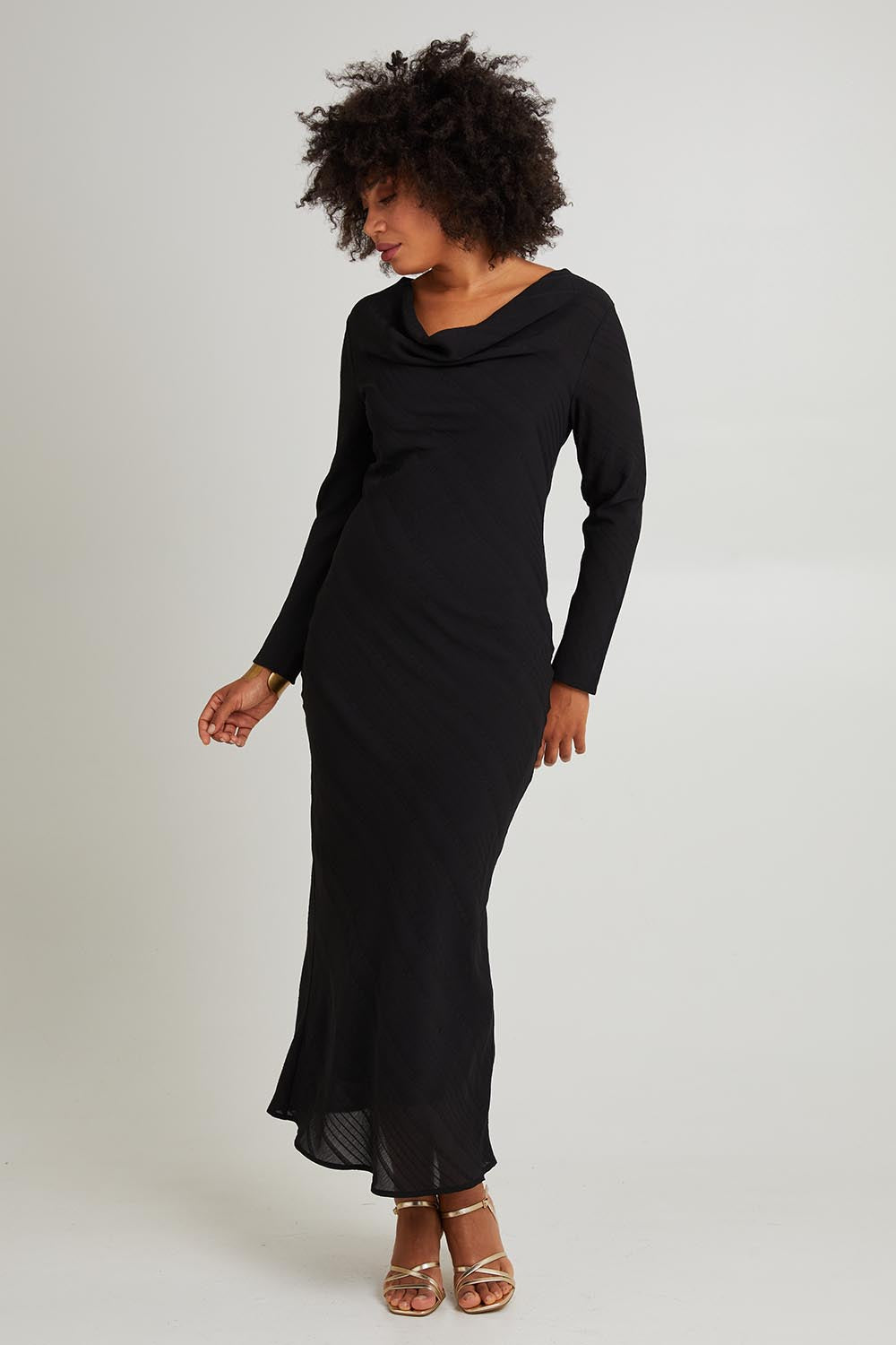 Model Olivia wearing size 10 of the Jemima Dress in colour Black (Black), from the front, showing the whole outfit