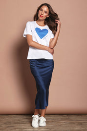 Model Madeline wearing size 10 of the Loulou Satin Skirt in colour Steelblue (Blue), from the front, showing the whole outfit