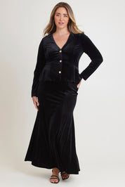 Model Chanel wearing size 16 of the Marlene Velvet Skirt in colour Black (Black), from the front, showing the whole outfit