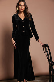 Model Madeline wearing size 10 of the Marlene Velvet Skirt in colour Black (Black), from the front, cropped image