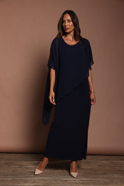 Model Amanda wearing size 10 of The Long Beatrice Dress in colour Navy (Blue), from the front, showing the whole outfit