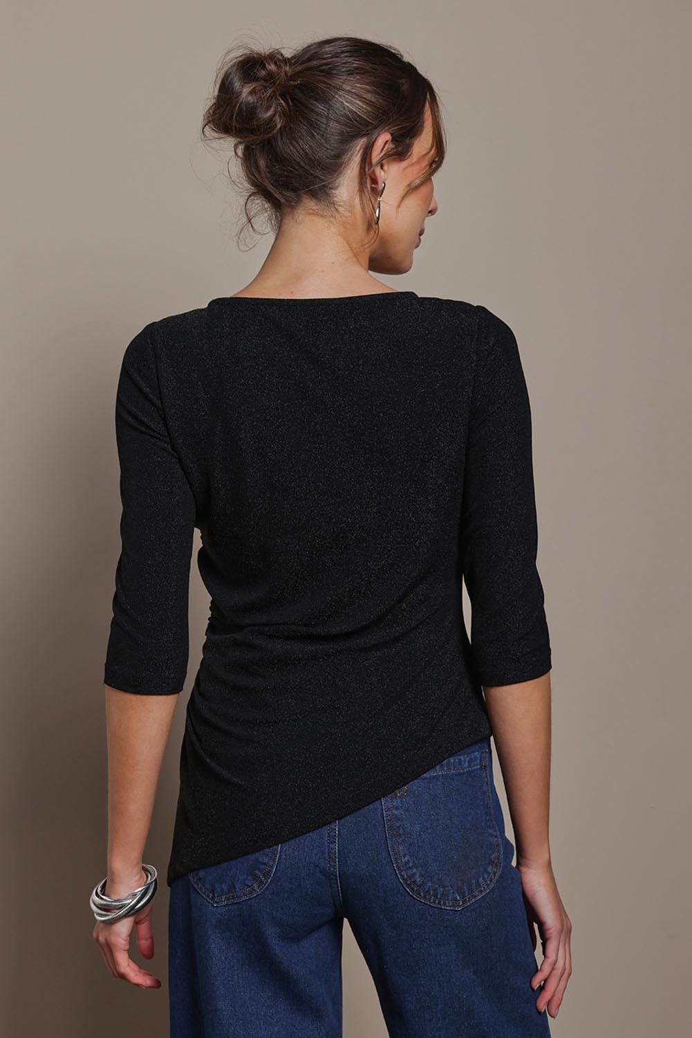 Model Madeline wearing size 10 of the Aisling Top in colour Black (Black), from the back