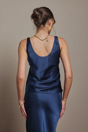Model Madeline wearing size 10 of the Celeste Satin Camisole in colour Steelblue (Blue), from the back