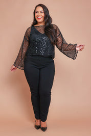 Model Ashleigh wearing size L of the Nina Sequin Top in colour Black (Black), from the front, showing the whole outfit