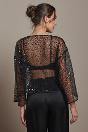 Model Madeline wearing size S of the Nina Sequin Top in colour Black (Black), from the back