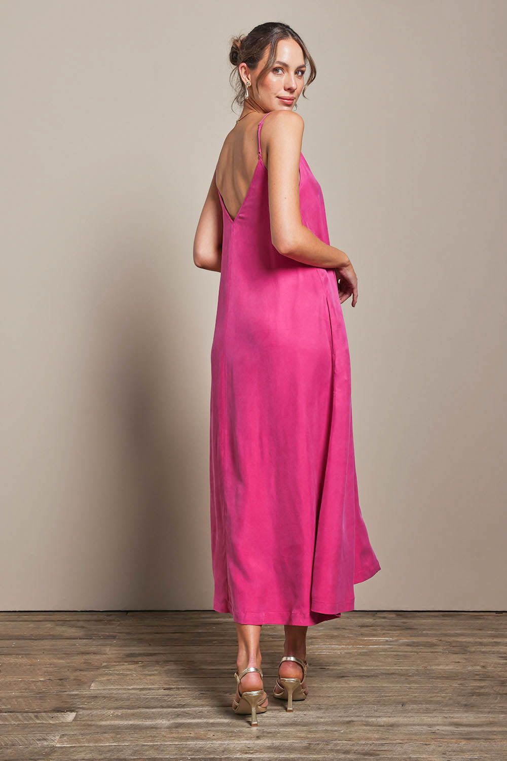 Model Madelinec wearing size 10 of the Edith Dress - Magenta in colour Magenta, from the front