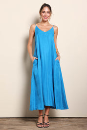 Model Maddiec wearing size 10 of the Edith Dress – Pacific in colour Pacific, from the front