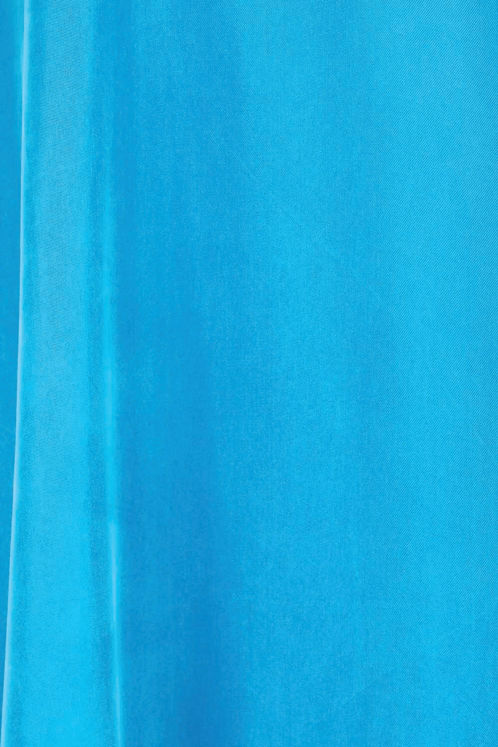 Product shot of the Edith Dress – Pacific in colour Pacific, showing detail
