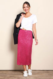 Model Maddiec wearing size 10 of the Reegan Sequin Skirt – Cerise in colour Cerise, from the front