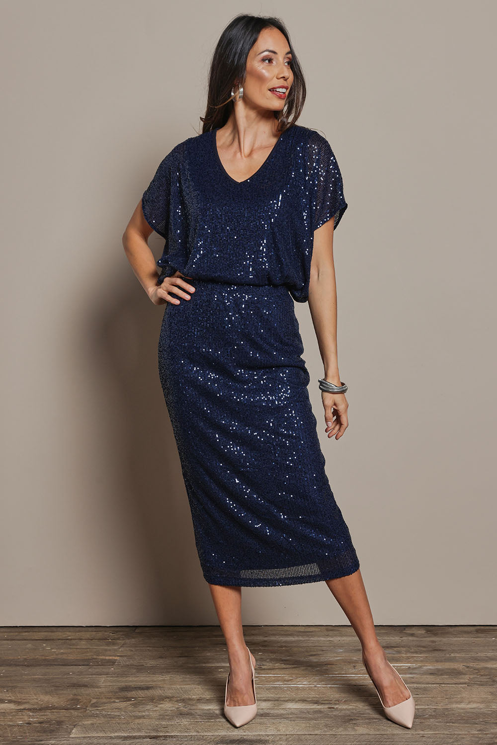 Model Amanda wearing size 10 of the Reegan Sequin Skirt in colour Navy (Metallics), from the front, showing the whole outfit