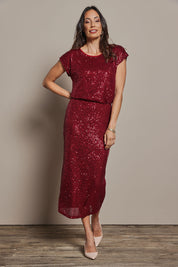 Model Amanda wearing size 10 of the Reegan Sequin Skirt in colour Rouge (Metallics), from the front, showing the whole outfit