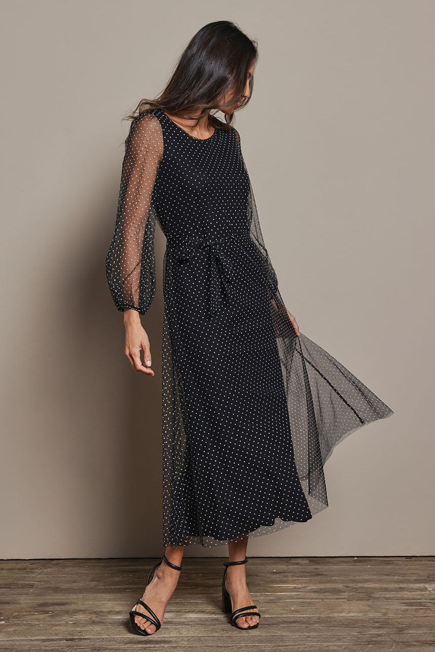Model Amanda wearing size 10 of the Lorraine Dress in colour Whitedot (Black), from the front, showing the whole outfit