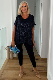 Model Sandy wearing size 10 of the Renee Sequin Top in colour Navy (Metallics), from the front, showing the whole outfit