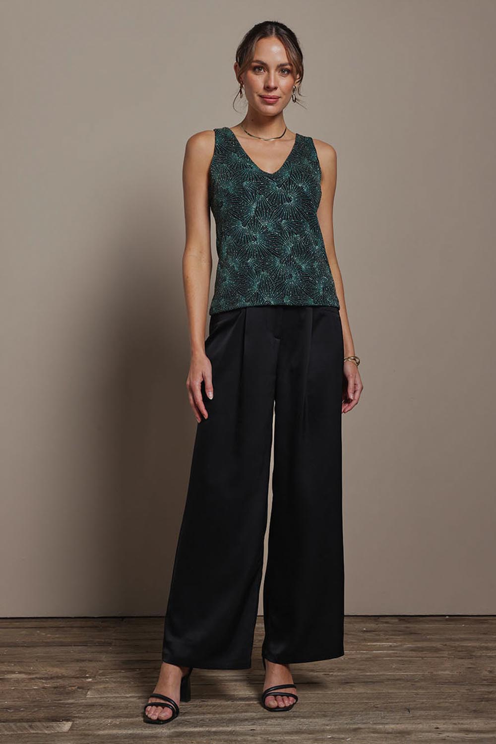 Model Madeline wearing size 10 of the Nadia Camisole in colour Jadebling (Green), from the front, showing the whole outfit
