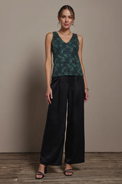 Model Madeline wearing size 10 of the Nadia Camisole in colour Jadebling (Green), from the front, showing the whole outfit