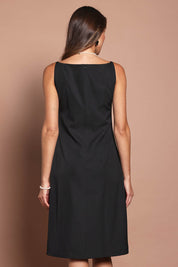 Model Madeline wearing size 10 of the Audrey Dress in colour Black (Black), from the back