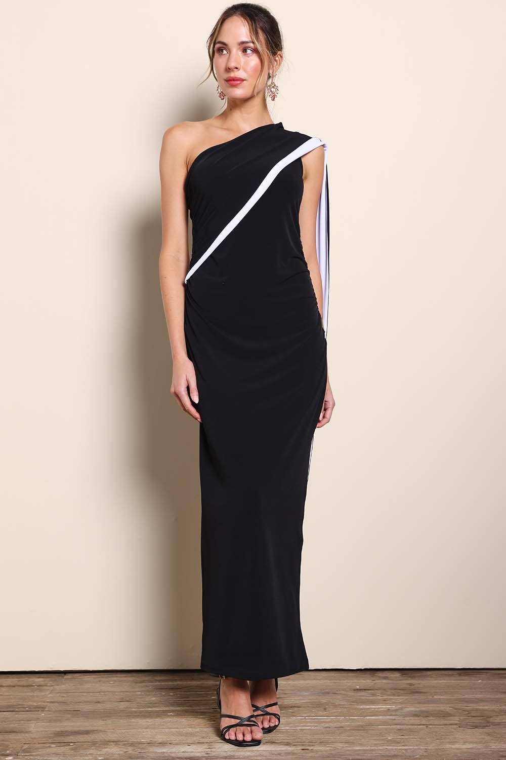 Model Maddiec wearing size 10 of the Camille Reversable Dress – Black in colour Black, from the front
