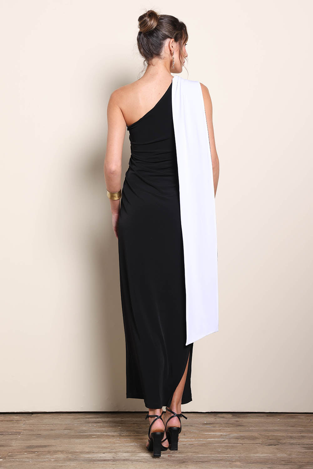 Model Maddiec wearing size 10 of the Camille Reversable Dress – Black in colour Black, from the front