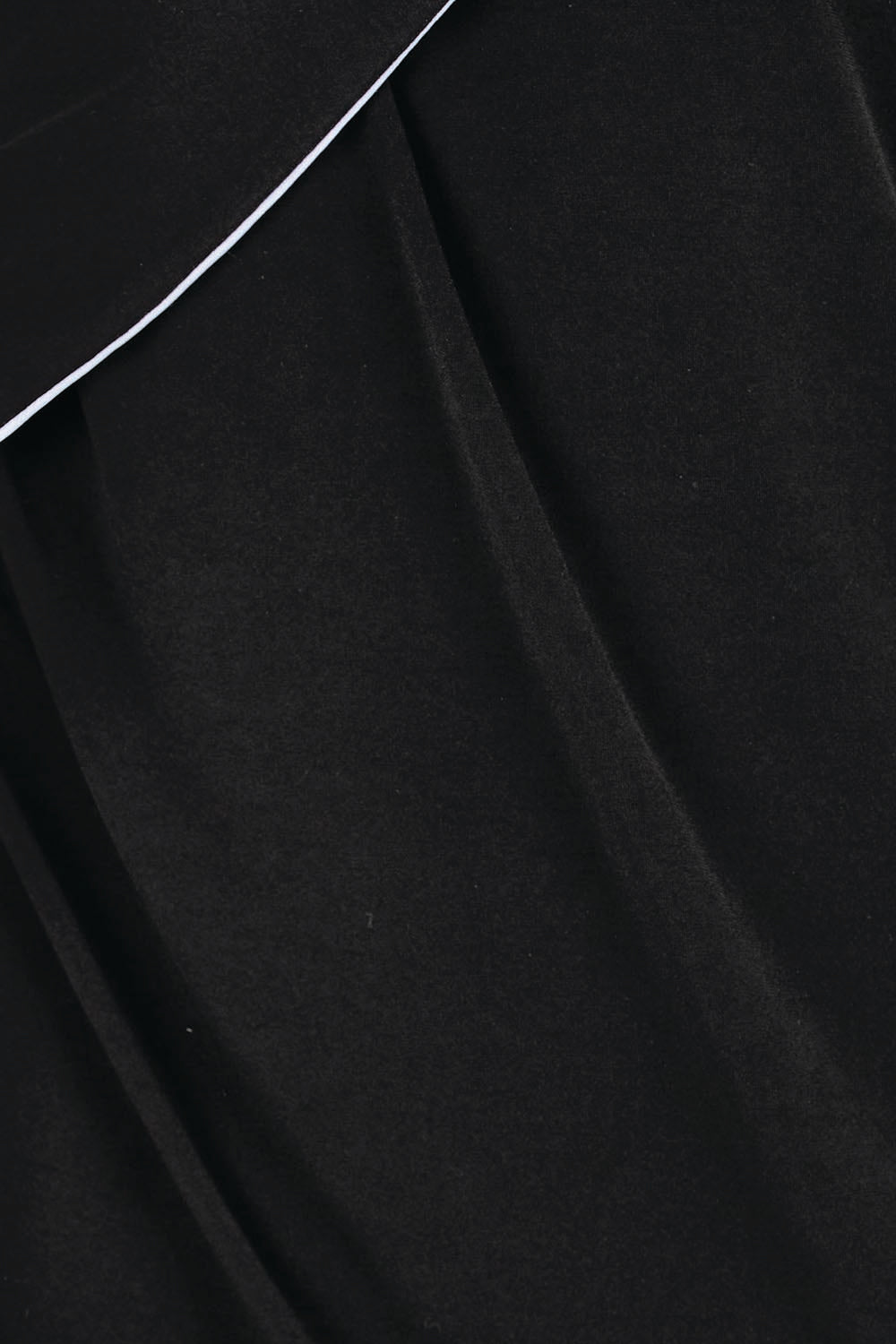 Product shot of the Camille Reversable Dress – Black in colour Black, showing detail