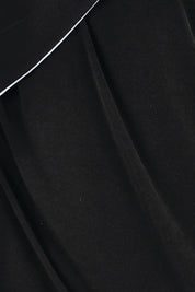 Product shot of the Camille Reversable Dress – Black in colour Black, showing detail