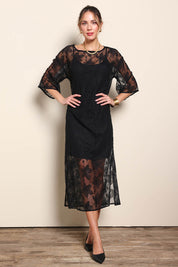 Model Maddiec wearing size 10 of the Nina Lace Dress - Black in colour Black, from the front