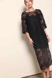 Model Maddiec wearing size 10 of the Nina Lace Dress - Black in colour Black, from the front