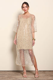 Model Maddiec wearing size 10 of the Nina Sequindress – Gold in colour Gold, from the front