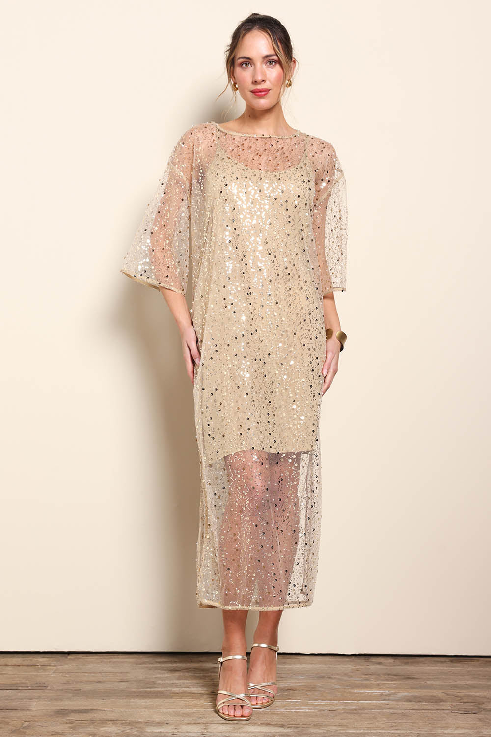 Model Maddiec wearing size 10 of the Nina Sequindress – Gold in colour Gold, from the front