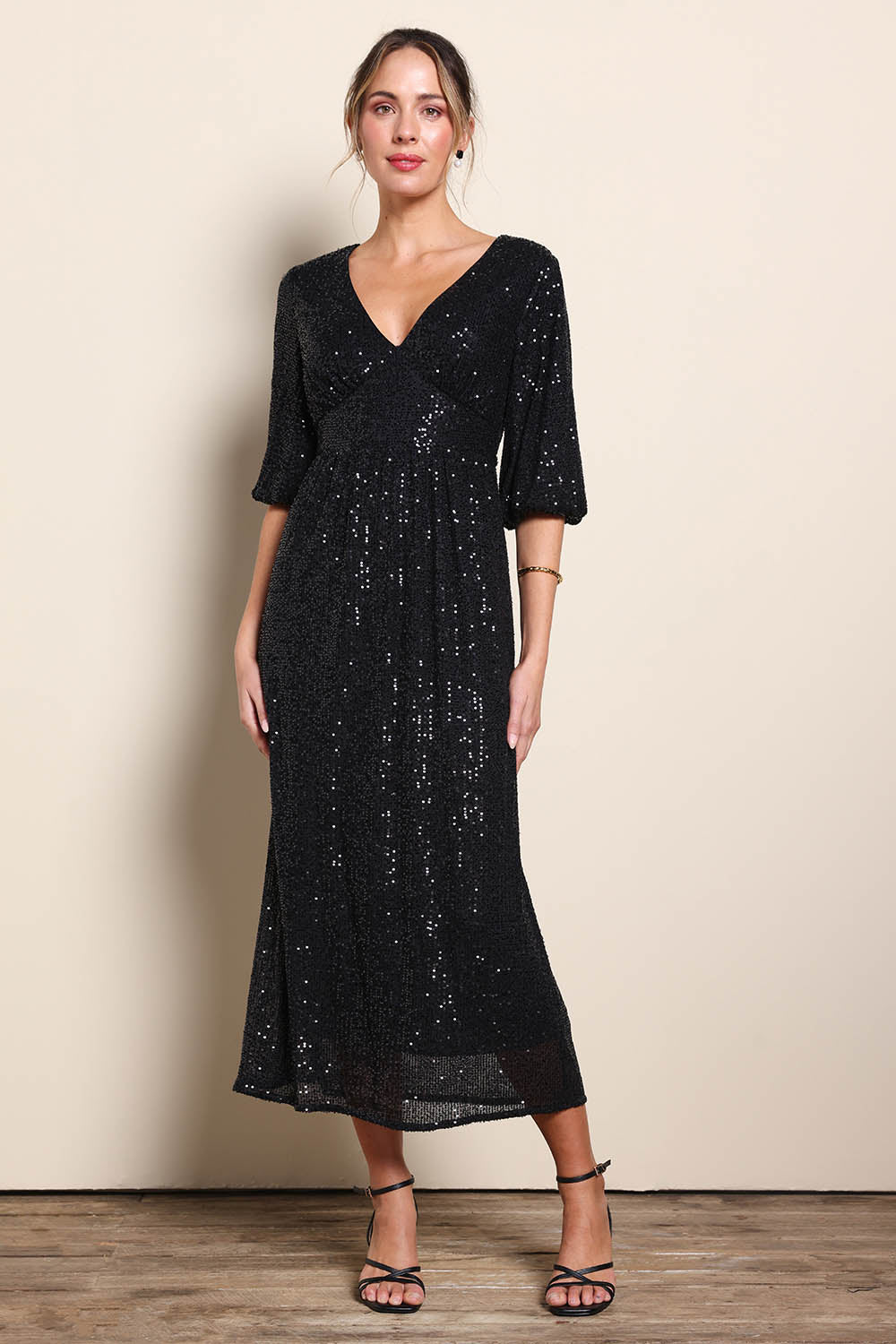 Model Maddiec wearing size 10 of the Priscilla Evening Gown – Black in colour Black, from the front