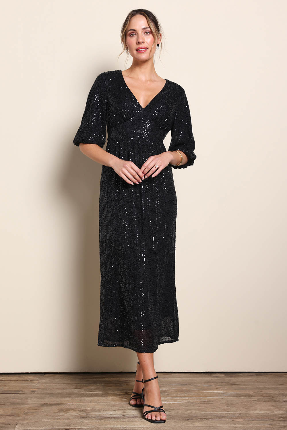 Model Maddiec wearing size 10 of the Priscilla Evening Gown – Black in colour Black, from the front