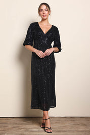 Model Maddiec wearing size 10 of the Priscilla Evening Gown – Black in colour Black, from the front