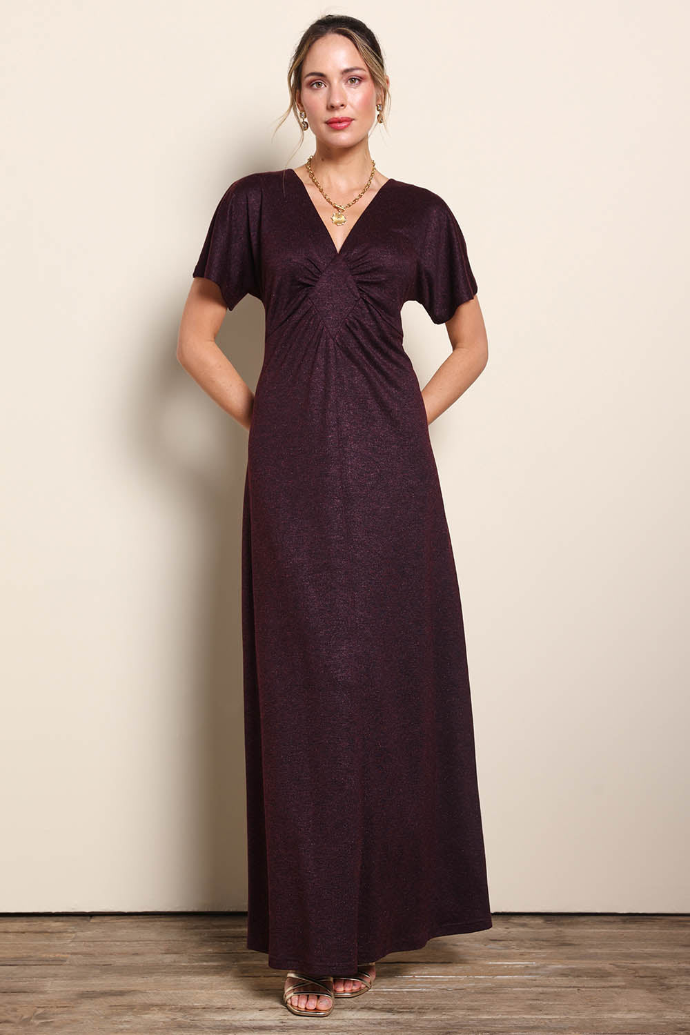 Model Maddiec wearing size 10 of the Glenda Evening Gown - Garnet in colour Garnet, from the front