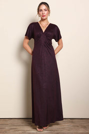 Model Maddiec wearing size 10 of the Glenda Evening Gown - Garnet in colour Garnet, from the front