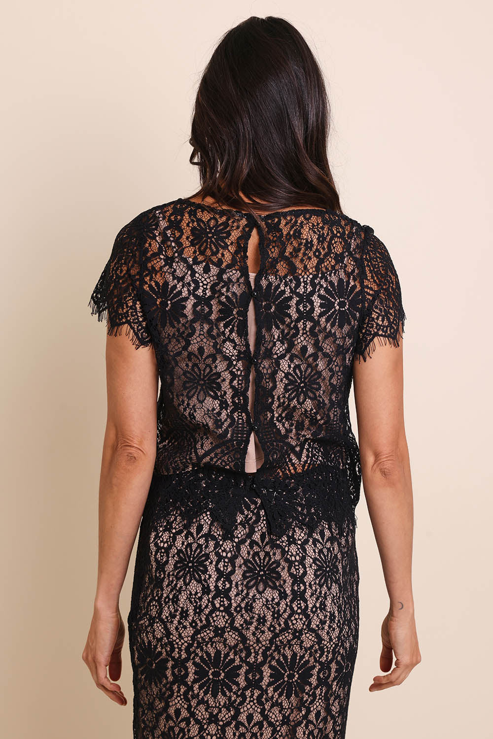 Model Amandam wearing size 10 of the Kiki Lace Top - Black in colour Black, from the back