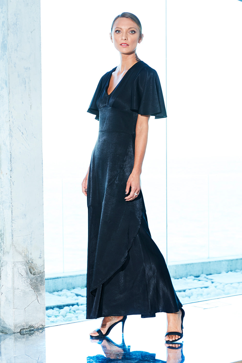 Model Jira wearing size 8 of the Fleur Dress in colour Black (Black), from the front, showing the whole outfit