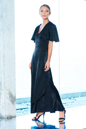 Model Jira wearing size 8 of the Fleur Dress in colour Black (Black), from the front, showing the whole outfit