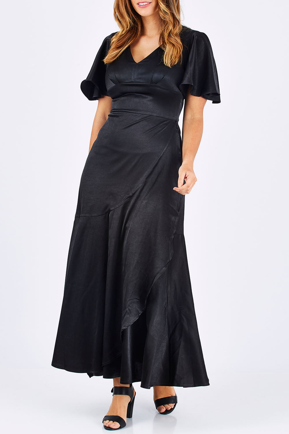 Model Laura wearing size 12 of the Fleur Dress in colour Black (Black), from the front, cropped image